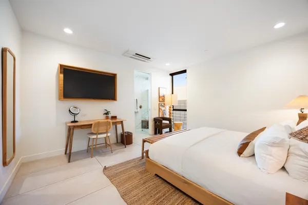 a view of a swimming pool with a patio and a yard