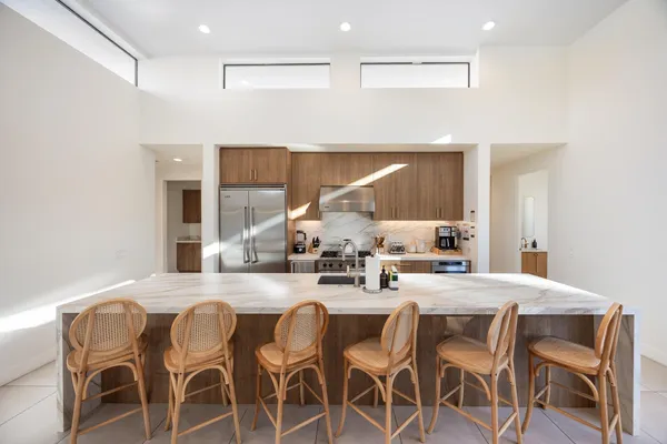 a view of a patio with swimming pool table and chairs