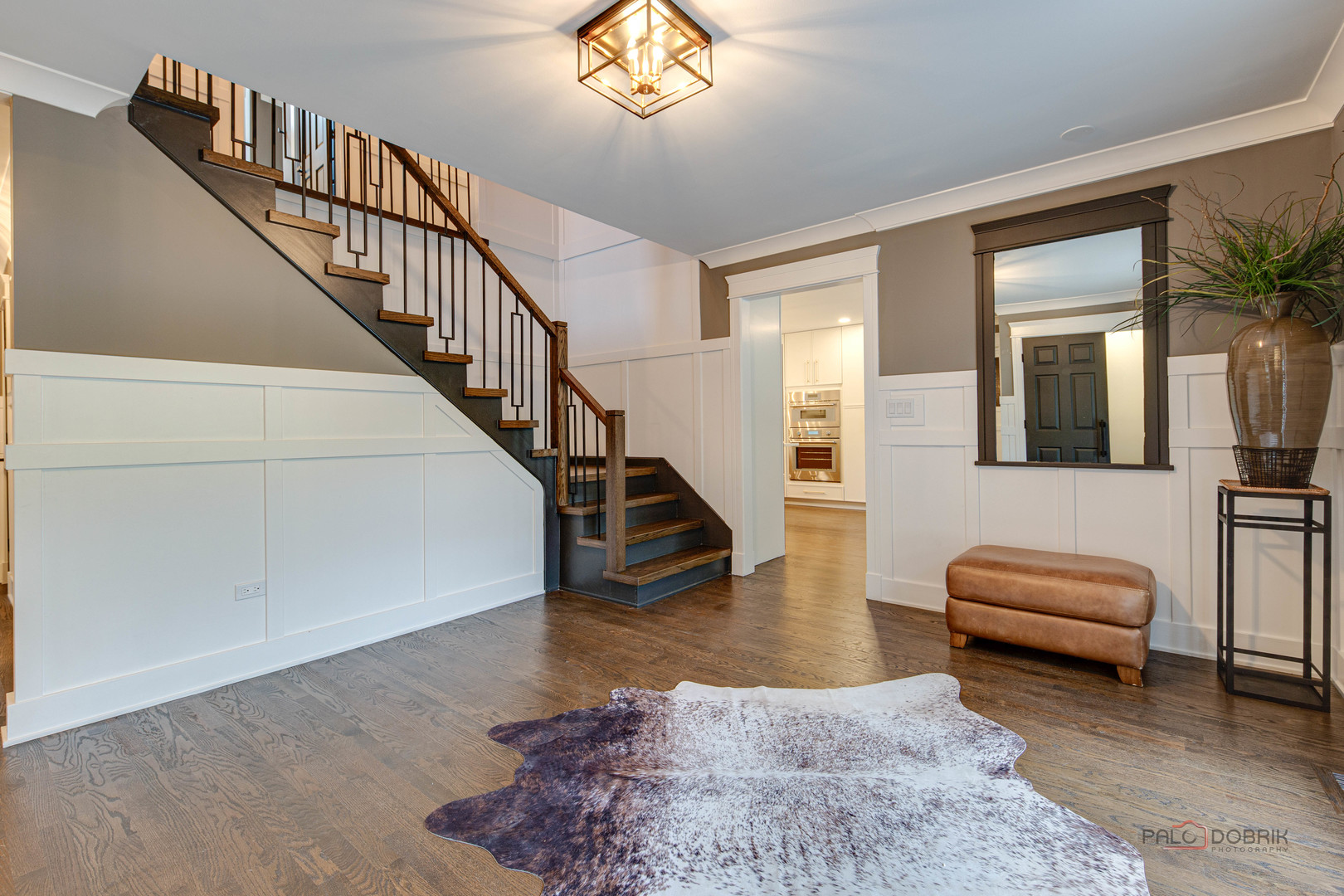 2221 Donegal Drive Darien, IL 60561 - Photo 17 of 62 a living room with furniture floor to ceiling window and a flat screen tv