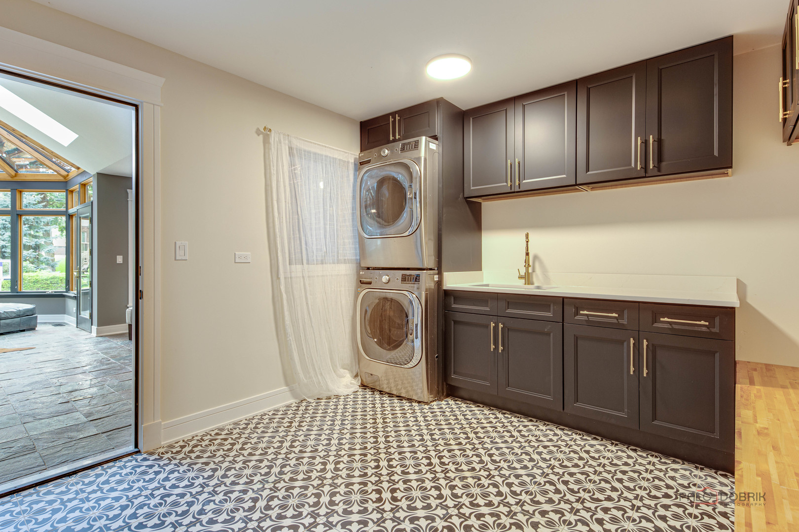 2221 Donegal Drive Darien, IL 60561 - Photo 26 of 62 a bathroom with a sink a washer and dryer