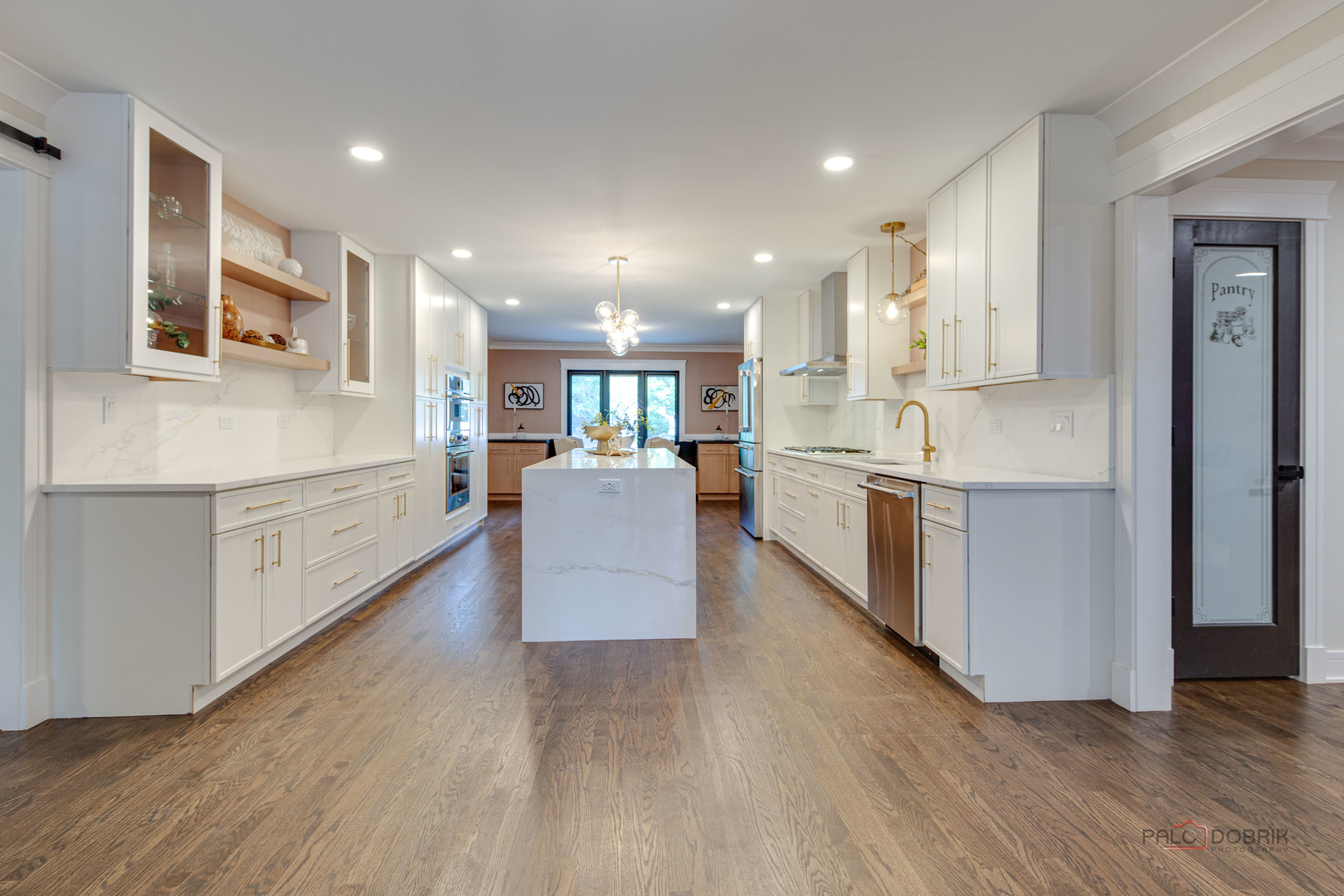 2221 Donegal Drive Darien, IL 60561 - Photo 28 of 62 a large kitchen with stainless steel appliances kitchen island a large counter top and a stove top oven