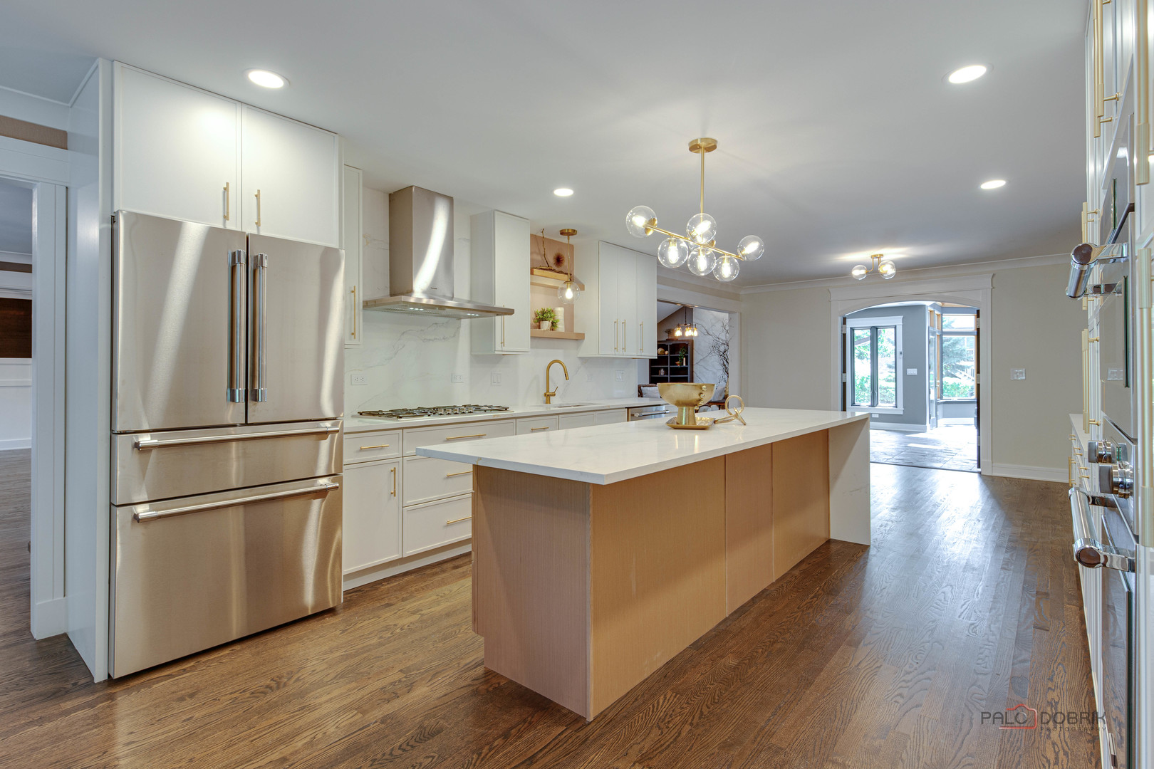 2221 Donegal Drive Darien, IL 60561 - Photo 31 of 62 a kitchen with kitchen island a sink stainless steel appliances and wooden floor