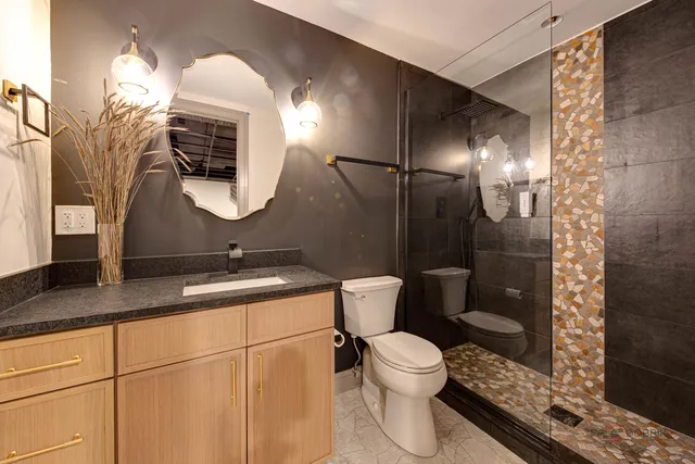 a bathroom with a bathtub and a shower