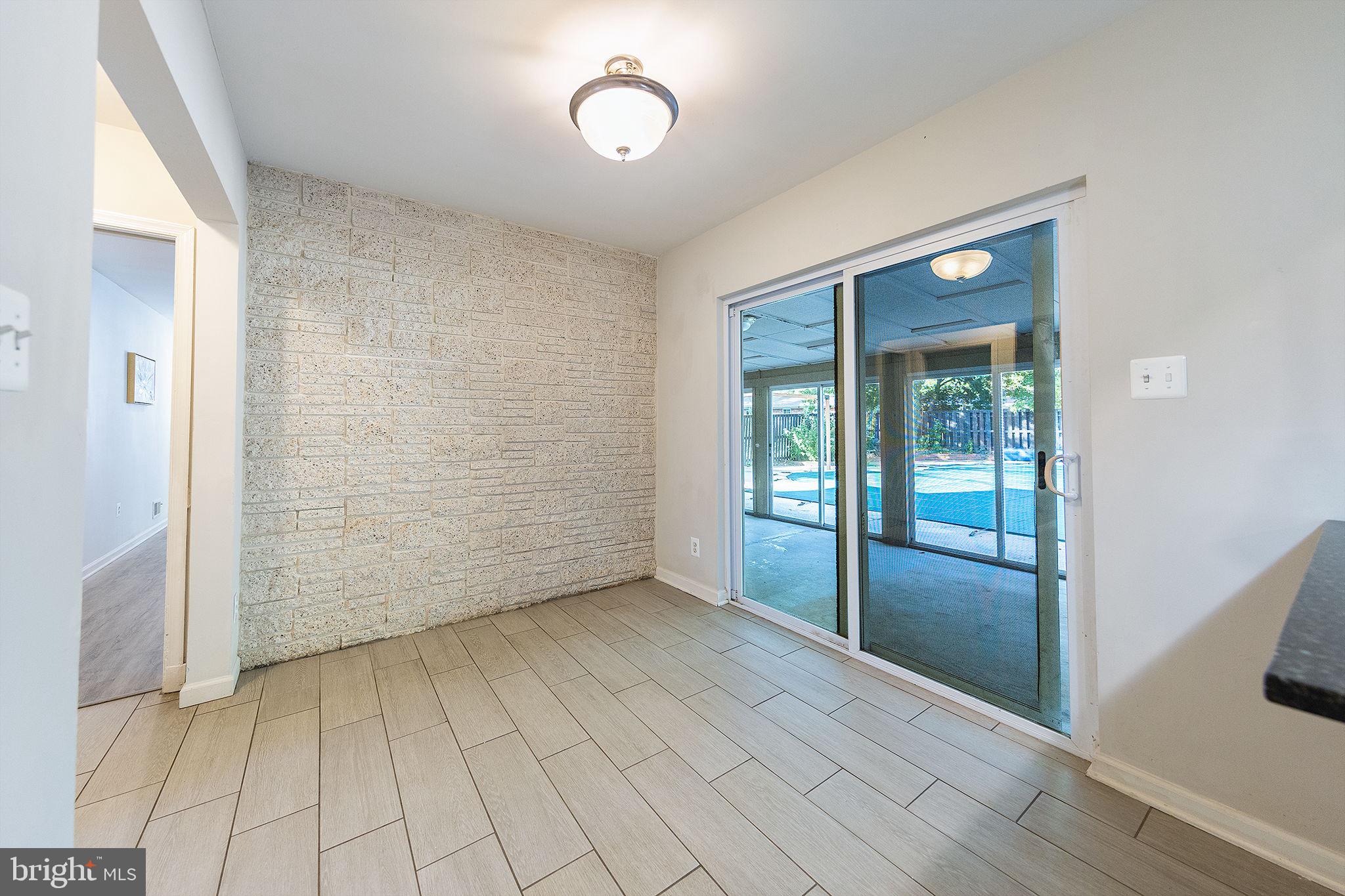 7104 Bock Road Fort Washington, MD 20744 - Photo 20 of 46 Eat-In Kitchen leads to Sunroom