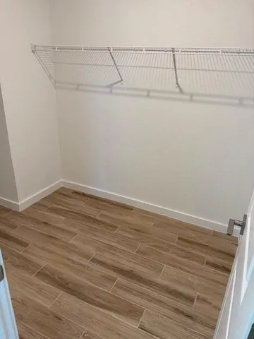 a bathroom with double vanity sink and a mirror