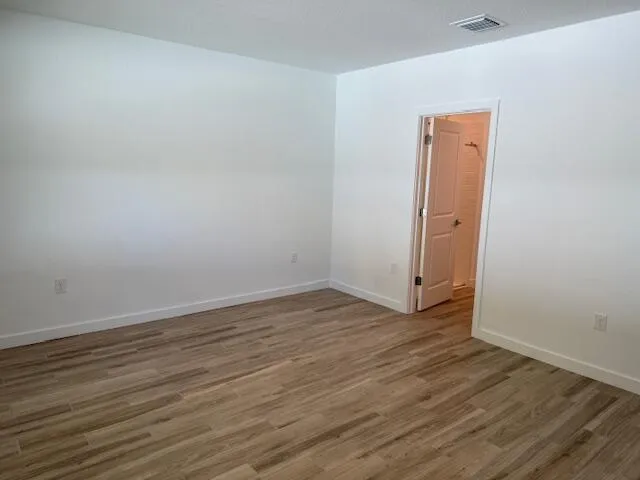 a kitchen with stainless steel appliances granite countertop a stove a refrigerator and a sink