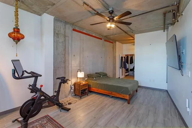 a bedroom with furniture and a window