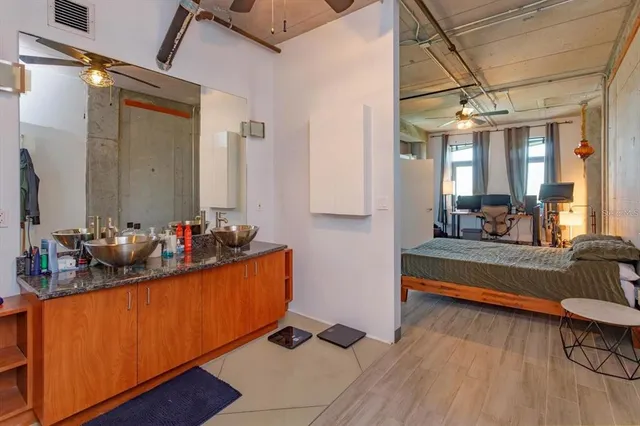 a view of living room with furniture and wooden floor