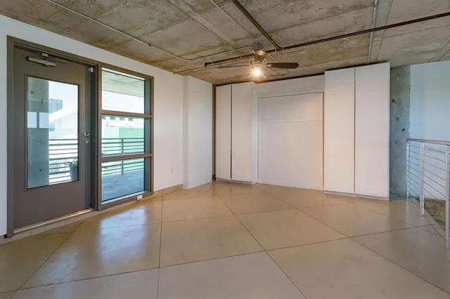 a view of an empty room with a fireplace