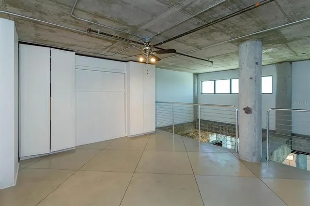 a view of a hallway with seating area
