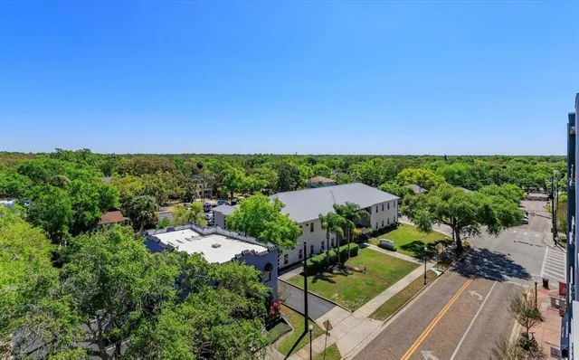 a view of city from balcony with seating space