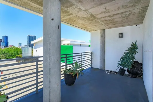 a view of a balcony with chairs