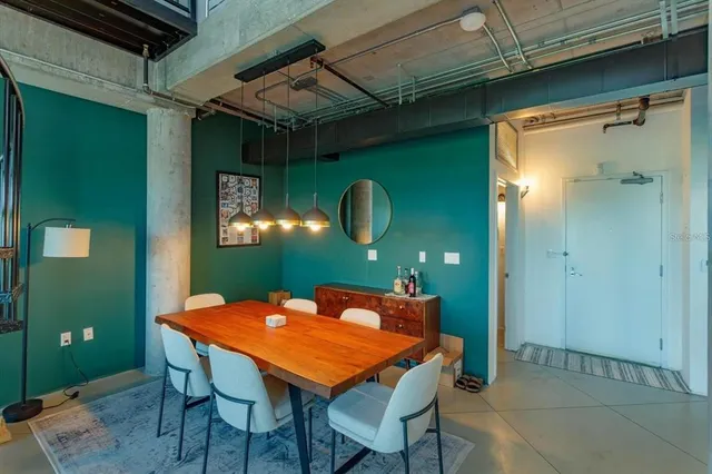 a dining room with a table and chairs