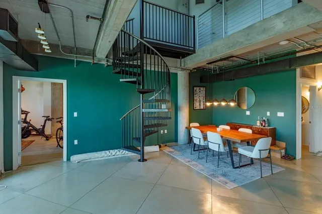 a backyard of a house with barbeque oven table and chairs