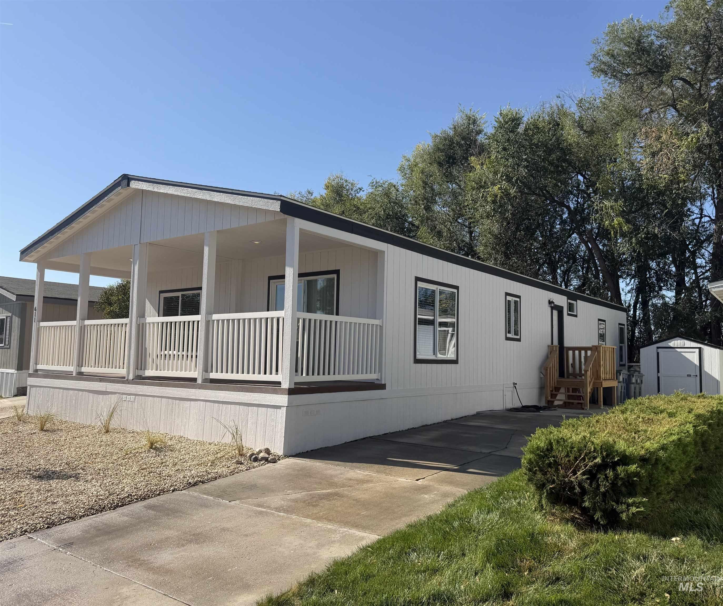 611 North Timathy Road Boise, ID 83713 - Photo 2 of 28 White siding exterior with black trim windows