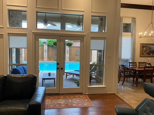 a living room with furniture and wooden floor