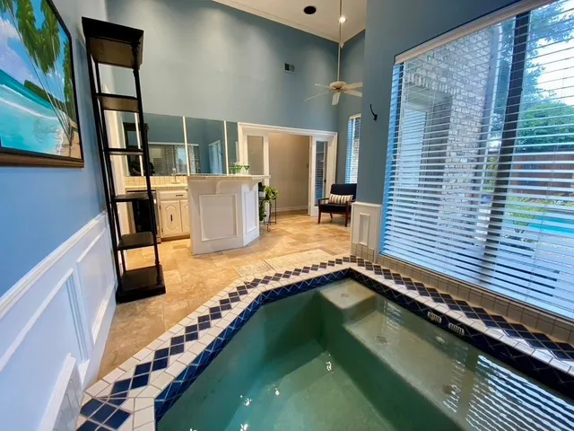 a bathroom with a bathtub and shower