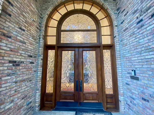 a view of an entryway with wooden floor and door