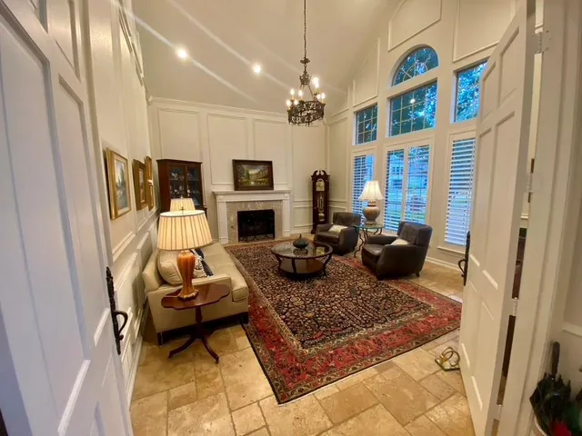 a living room with furniture flat screen tv and a fireplace