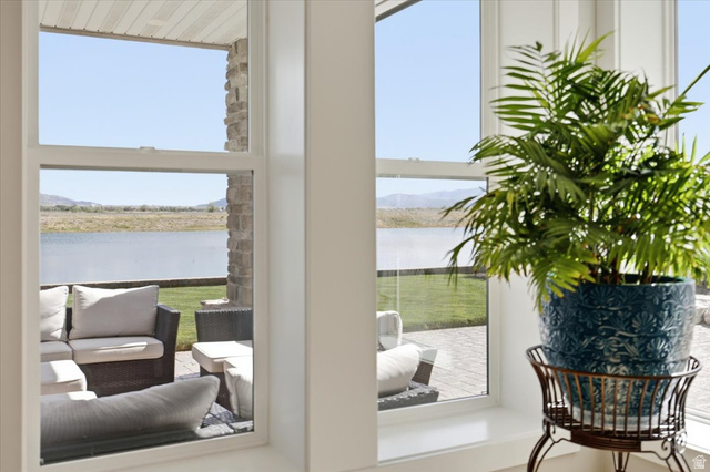 21 Pier Place Tooele, UT 84074 - Photo 61 of 112 Large windows framing a water feature and distant mountains