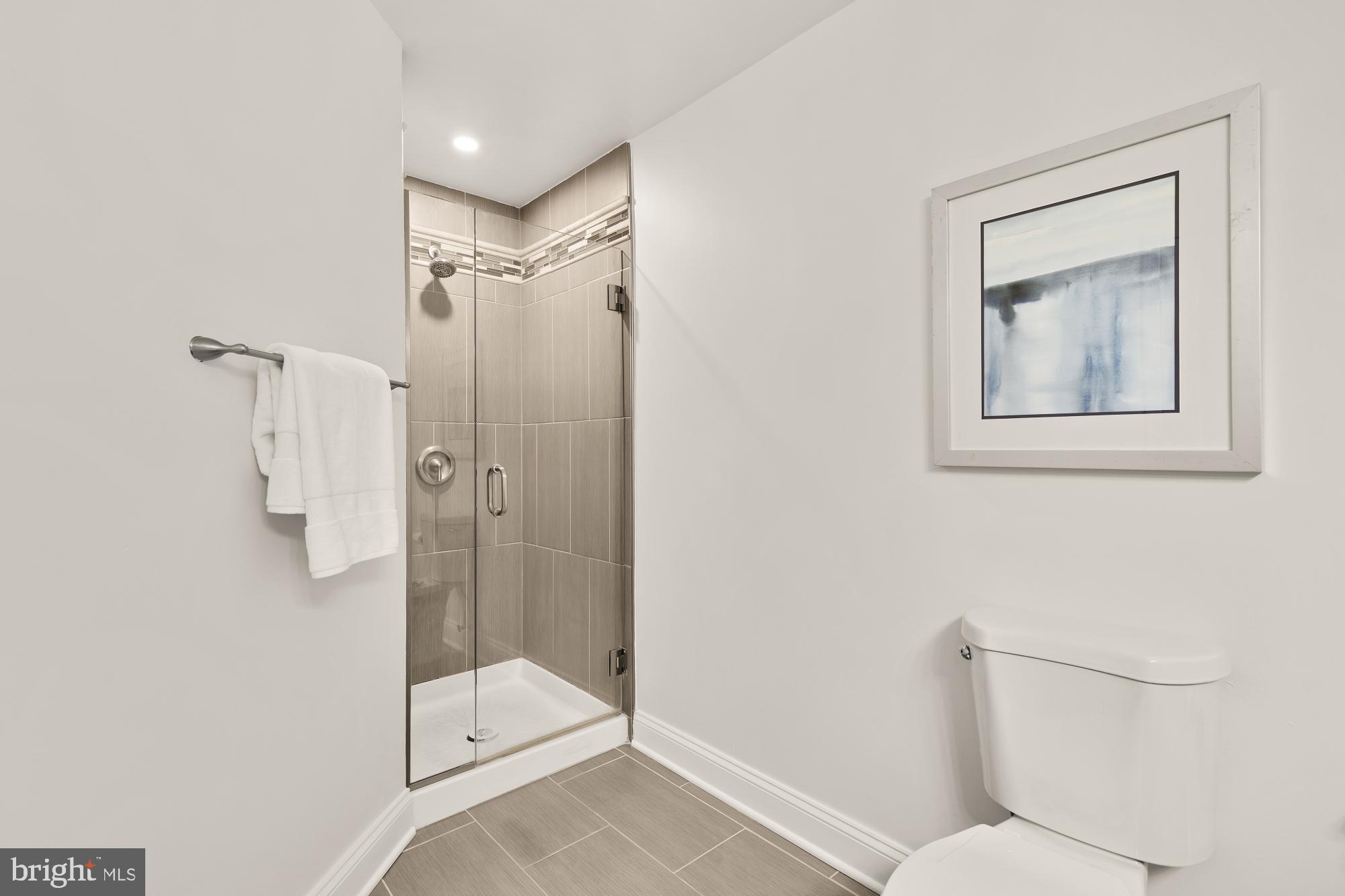2004 11th Street Northwest, Unit 124 Washington, DC 20001 - Photo 30 of 35 a bathroom with a shower and toilet