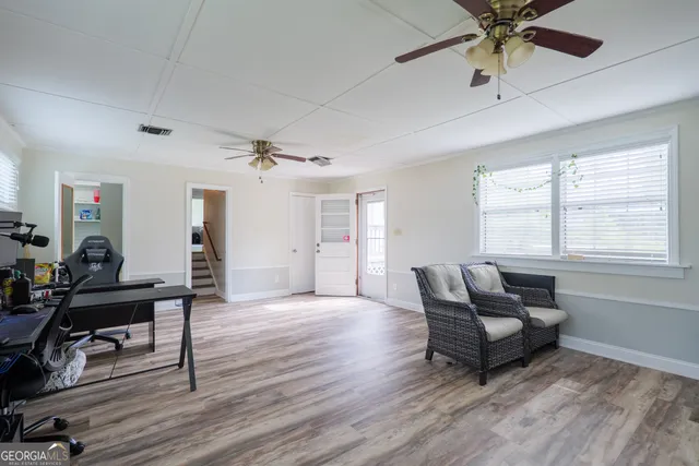 a living room with furniture and a window