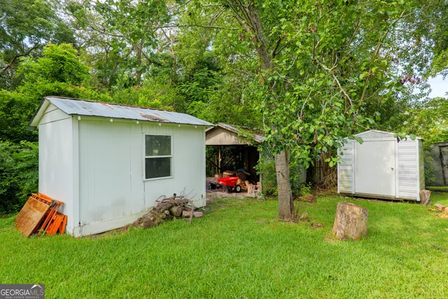 a back view of a house with backyard