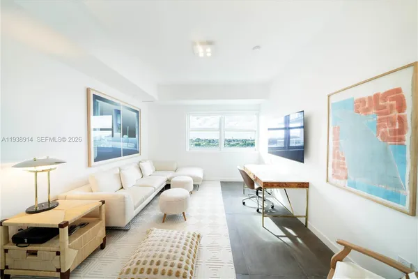 a living room with furniture and a table