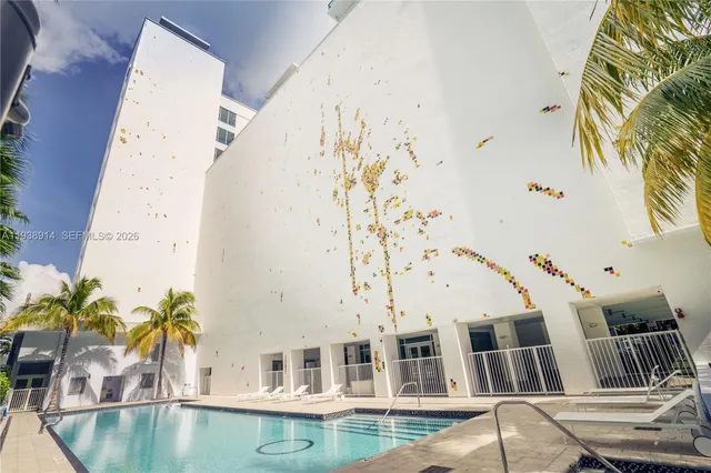 a view of pool with outdoor seating