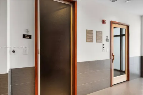 a view of a room with furniture and windows