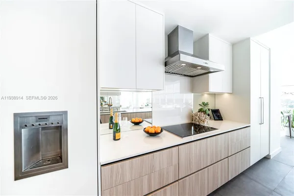 a kitchen with stainless steel appliances a sink and cabinets