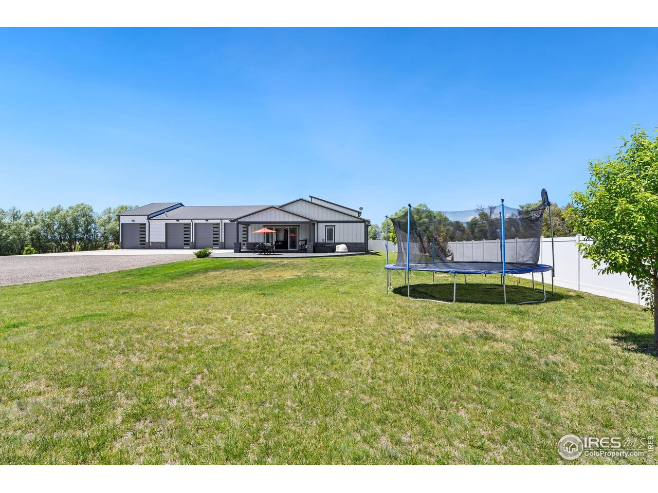 3482 Southeast Frontage Road Fort Collins, CO 80525 - Photo 22 of 47 a view of a house with a big yard