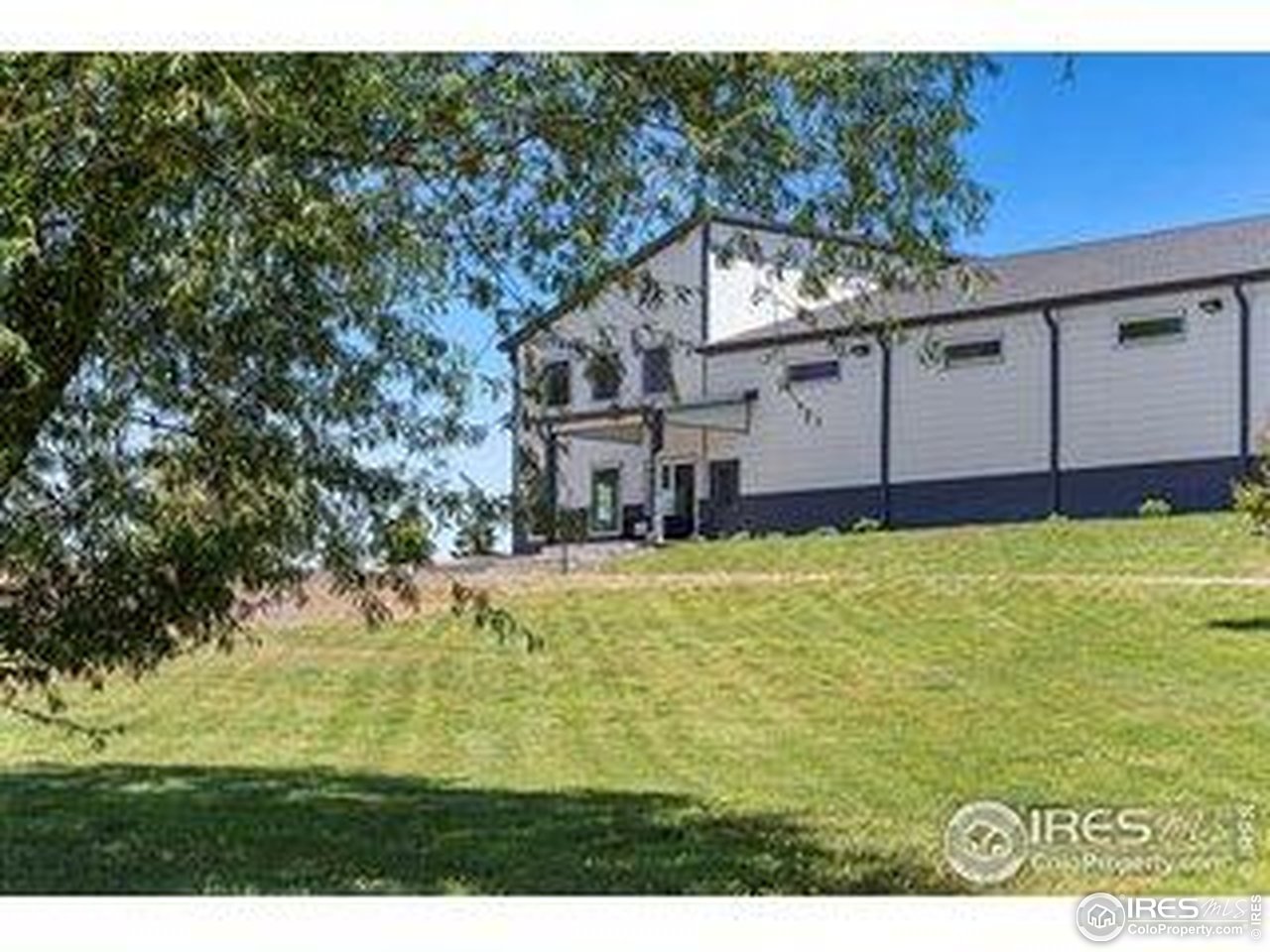 3482 Southeast Frontage Road Fort Collins, CO 80525 - Photo 45 of 47 a view of a house with a yard