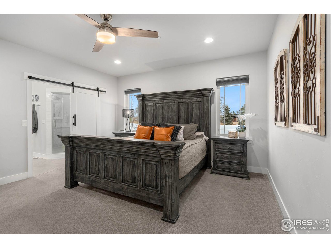 3482 Southeast Frontage Road Fort Collins, CO 80525 - Photo 8 of 47 a bed room with a bed and a chandelier