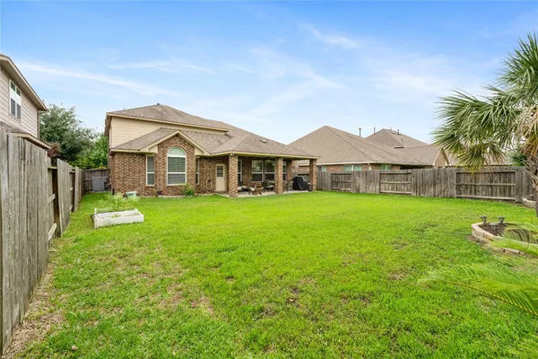 a view of a house with a yard porch and sitting area
