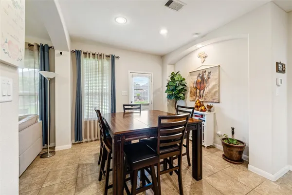 a view of a dining room with furniture