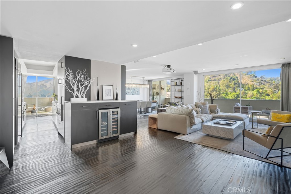 7250 Franklin Avenue, Unit 1203 Los Angeles, CA 90046 - Photo 2 of 37 a living room with furniture and a large window