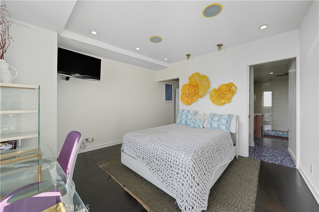 7250 Franklin Avenue, Unit 1203 Los Angeles, CA 90046 - Photo 27 of 37 a bedroom with a bed and flat screen tv