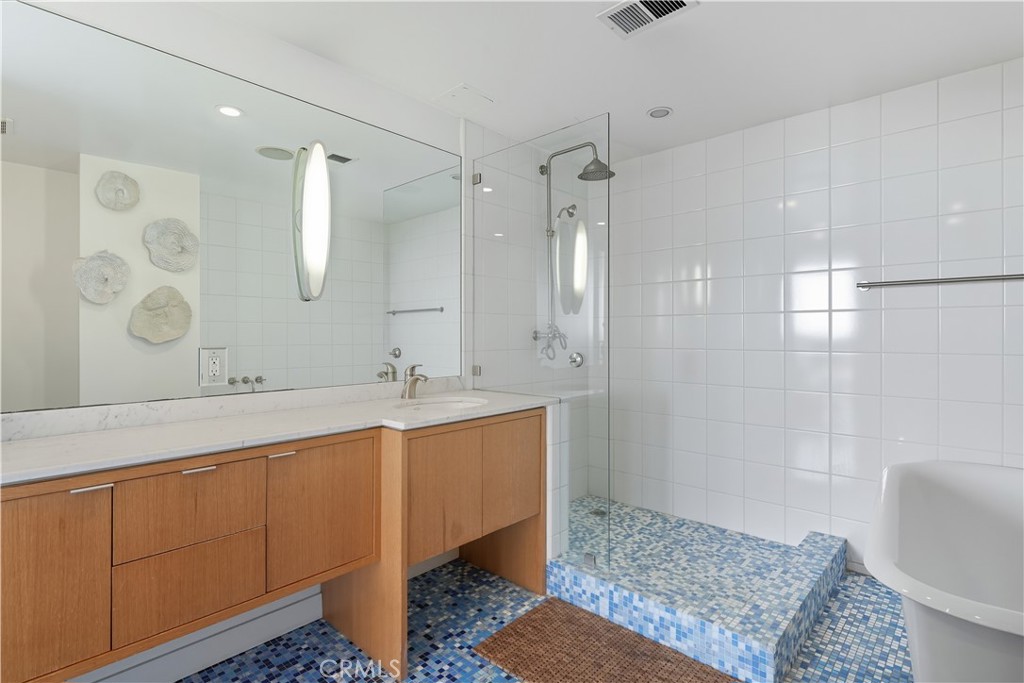 7250 Franklin Avenue, Unit 1203 Los Angeles, CA 90046 - Photo 29 of 37 a bathroom with a sink a toilet and shower