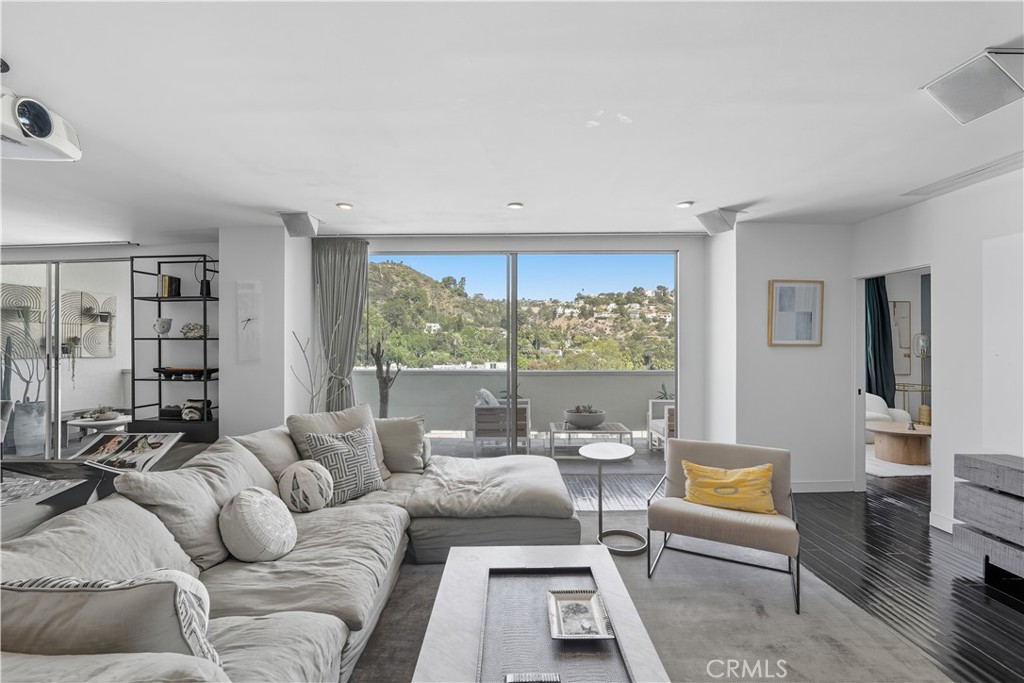 7250 Franklin Avenue, Unit 1203 Los Angeles, CA 90046 - Photo 3 of 37 a living room with furniture and a large window