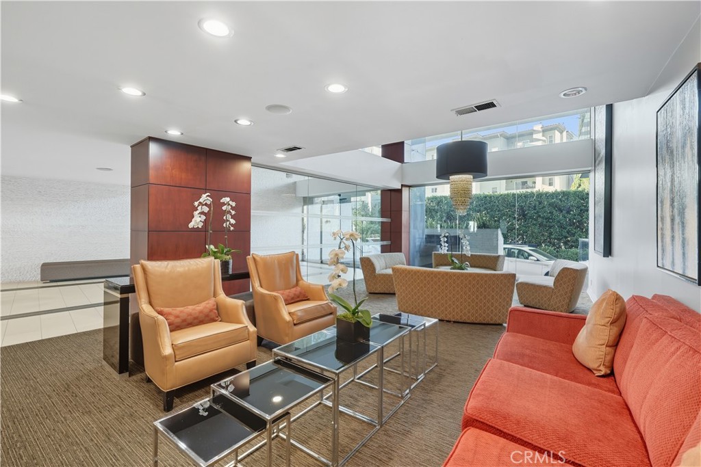 7250 Franklin Avenue, Unit 1203 Los Angeles, CA 90046 - Photo 31 of 37 a living room with furniture and a large window
