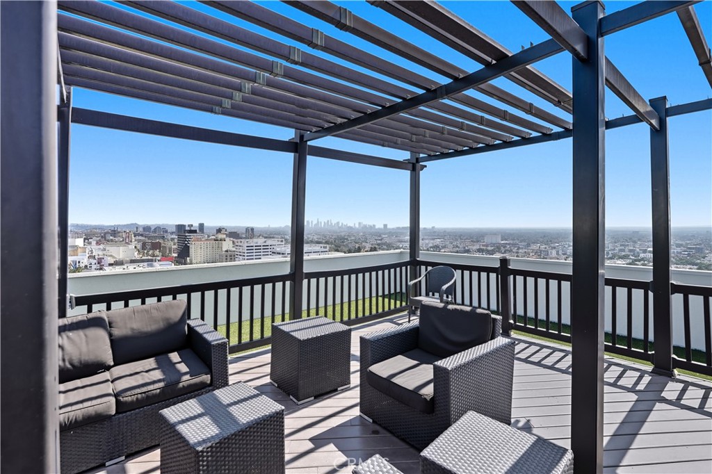 7250 Franklin Avenue, Unit 1203 Los Angeles, CA 90046 - Photo 33 of 37 a roof deck with couches and wooden floor
