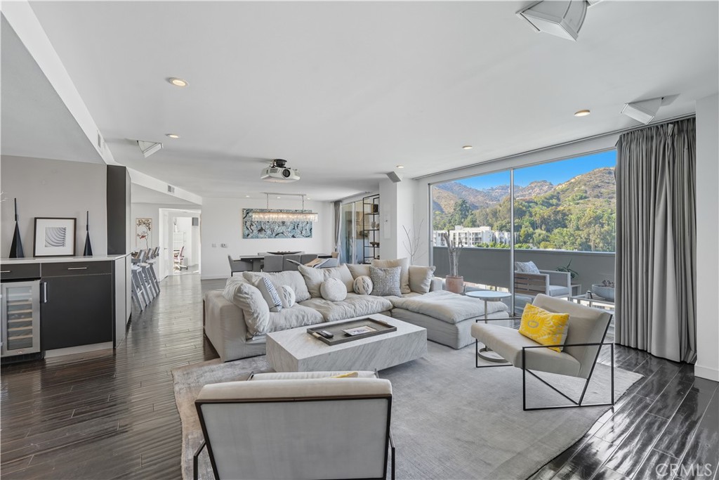 7250 Franklin Avenue, Unit 1203 Los Angeles, CA 90046 - Photo 5 of 37 a living room with furniture and a large window