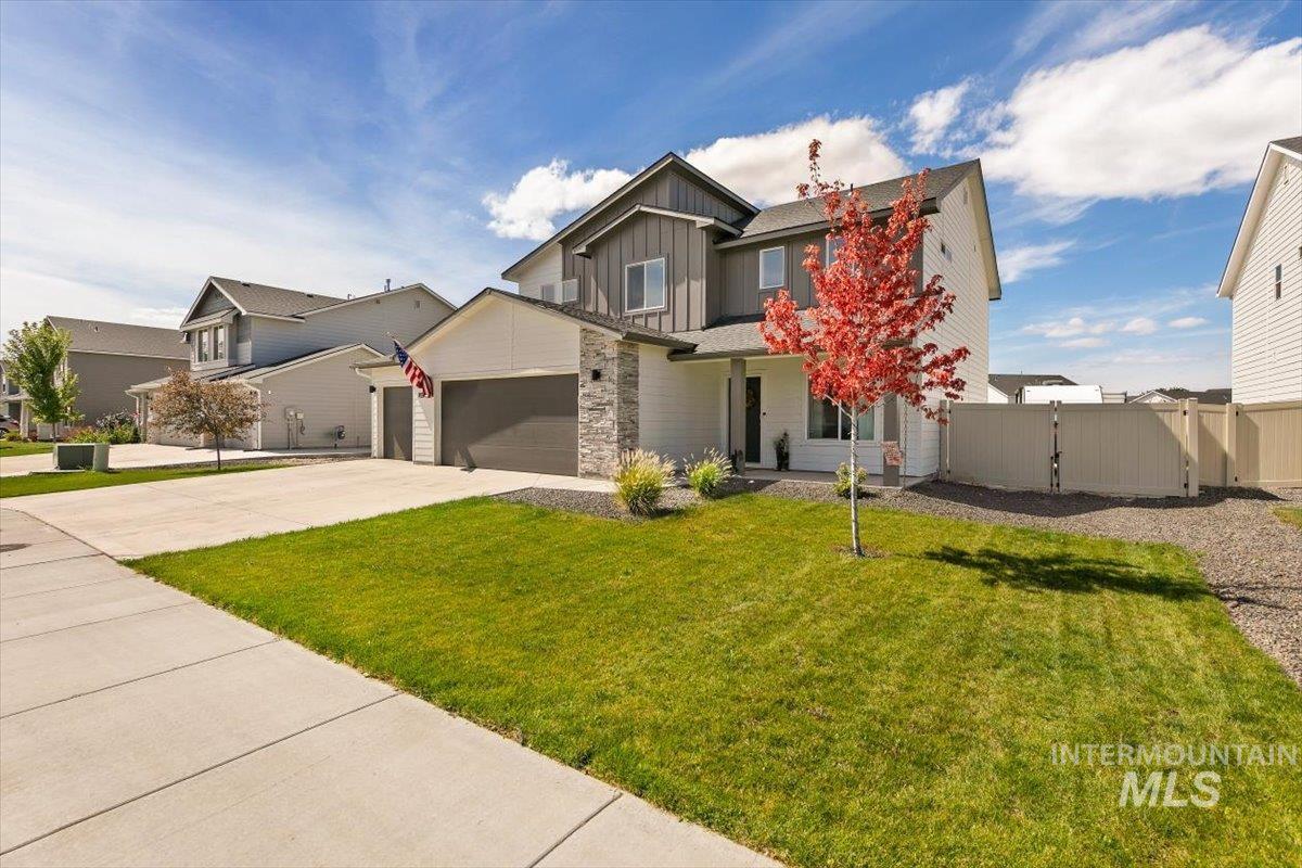 8575 South Foraker Way Kuna, ID 83634 - Photo 39 of 43 Two-story modern home with a gray and white exterior and stone accents