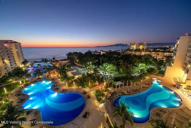 a view of a swimming pool with sitting area
