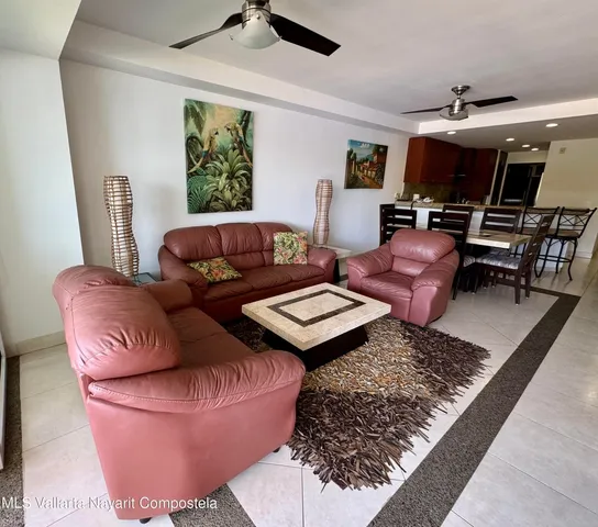 a living room with furniture and a rug