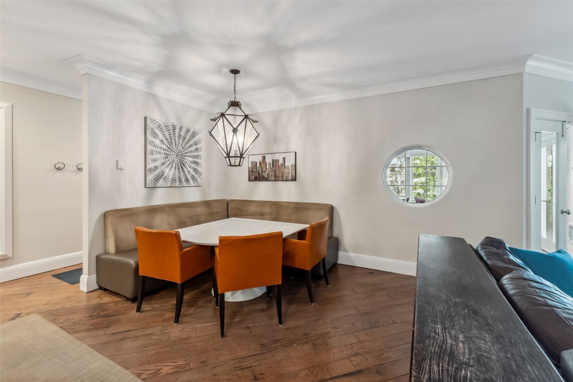 1207 West Keystone Road, Unit 2701 Keystone, CO 80435 - Photo 12 of 41 Dining room with crown molding, wood-type flooring, and a chandelier