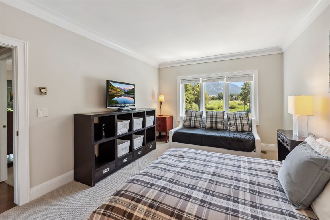1207 West Keystone Road, Unit 2701 Keystone, CO 80435 - Photo 20 of 41 Bedroom with carpet floors and ornamental molding