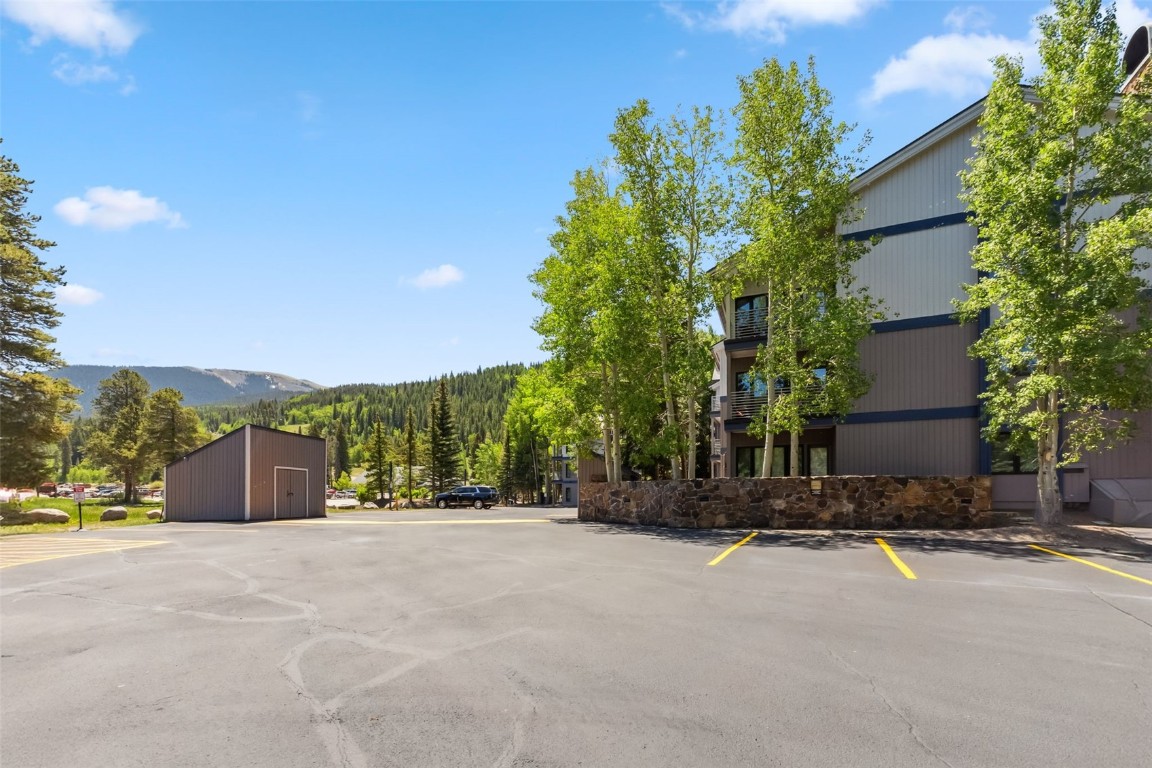 1207 West Keystone Road, Unit 2701 Keystone, CO 80435 - Photo 34 of 41 Uncovered parking lot featuring a mountain view