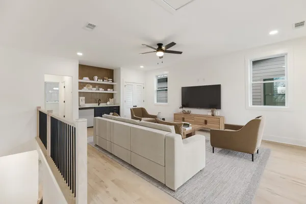 a view of living room with furniture and flat screen tv